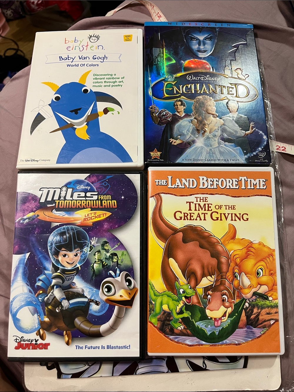 Disney DVD Lot featuring Blue, Orange, Purple, White Covers